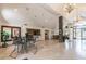 Spacious clubhouse with travertine floors, high ceilings, and elegant chandelier lighting at 10265 Gandy N Blvd # 1004, St Petersburg, FL 33702