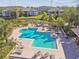 Community pool with lounge chairs at 10265 Gandy N Blvd # 1004, St Petersburg, FL 33702