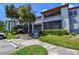 Inviting condo exterior featuring lush greenery, creating a serene and appealing atmosphere for residents at 10265 Gandy N Blvd # 1004, St Petersburg, FL 33702