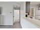 Hallway leading to kitchen with view of laundry at 10265 Gandy N Blvd # 1004, St Petersburg, FL 33702
