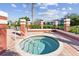 Community hot tub is surrounded by red brick, with nice landscaping and residential buildings visible at 10265 Gandy N Blvd # 1004, St Petersburg, FL 33702