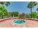 Relaxing hot tub surrounded by lush landscaping and serene water views at 10265 Gandy N Blvd # 1004, St Petersburg, FL 33702