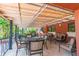 Covered outdoor patio with comfortable seating, ceiling fans, and peaceful views at 10265 Gandy N Blvd # 1004, St Petersburg, FL 33702
