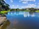 Scenic pond view reflecting the blue sky and clouds at 10265 Gandy N Blvd # 1004, St Petersburg, FL 33702
