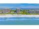 Aerial view of beachfront condo building with private beach access and stunning Gulf views at 1211 Gulf Of Mexico Dr # 704, Longboat Key, FL 34228