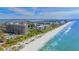 Aerial view of beachfront condos and private beach at 1211 Gulf Of Mexico Dr # 704, Longboat Key, FL 34228