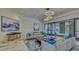 Lobby featuring modern furniture, a large rug, contemporary lighting, and abstract art at 1211 Gulf Of Mexico Dr # 704, Longboat Key, FL 34228