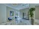 Lobby with a view of the elevator and decorated with modern art and elegant furniture at 1211 Gulf Of Mexico Dr # 704, Longboat Key, FL 34228