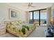 Serene main bedroom with balcony access, large windows with Gulf views, and a king-size bed at 1211 Gulf Of Mexico Dr # 704, Longboat Key, FL 34228