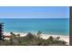 Stunning ocean view from building, with white sand beach below at 1211 Gulf Of Mexico Dr # 704, Longboat Key, FL 34228