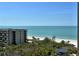 Stunning ocean view from a high-rise building overlooking a pristine beach at 1211 Gulf Of Mexico Dr # 704, Longboat Key, FL 34228