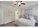 Cozy bedroom with neutral tones, soft carpet, and an ensuite bathroom, creating a relaxing retreat at 12710 Coastal Breeze Way, Bradenton, FL 34211