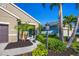 Attractive home with a welcoming front entrance framed by lush landscaping and a paved walkway at 12710 Coastal Breeze Way, Bradenton, FL 34211