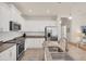 Modern kitchen with granite countertops, stainless steel appliances, and ample cabinet space at 12710 Coastal Breeze Way, Bradenton, FL 34211