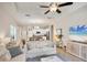 Bright, open-concept living room with a view of the kitchen and dining area, perfect for modern living at 12710 Coastal Breeze Way, Bradenton, FL 34211