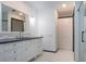 This bathroom has a tiled floor and a vanity with drawers as well as a glass enclosed shower at 1315 Bottlebrush Dr, Bradenton, FL 34208