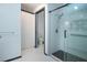 This bathroom has a tiled floor and a walk-in shower with grab bars at 1315 Bottlebrush Dr, Bradenton, FL 34208