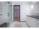 This bathroom has a tiled floor and a walk-in shower as well as a modern vanity at 1315 Bottlebrush Dr, Bradenton, FL 34208