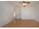 This bedroom has hardwood floors, natural light, a ceiling fan, and an ensuite at 1315 Bottlebrush Dr, Bradenton, FL 34208