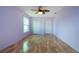 This bedroom has hardwood floors, natural light, ceiling fan, and spacious closet at 1315 Bottlebrush Dr, Bradenton, FL 34208