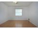 This bedroom has hardwood floors, natural light, and a ceiling fan at 1315 Bottlebrush Dr, Bradenton, FL 34208