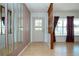 Inviting entryway with wood flooring, decorative accents, and a view into the sunny living space at 1315 Bottlebrush Dr, Bradenton, FL 34208