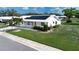 Charming single-Gathering home with lush landscaping, pristine lawn, and modern solar panels for energy efficiency at 1315 Bottlebrush Dr, Bradenton, FL 34208