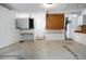 Spacious garage with concrete floor, storage cabinets, and a work area at 1315 Bottlebrush Dr, Bradenton, FL 34208