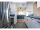 Modern kitchen with stainless steel appliances and white cabinets at 1315 Bottlebrush Dr, Bradenton, FL 34208