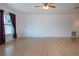 Spacious living room features bright wood flooring, large windows, and lots of natural light at 1315 Bottlebrush Dr, Bradenton, FL 34208