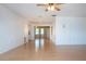 Bright, open living room featuring wood-look flooring and a ceiling fan at 1315 Bottlebrush Dr, Bradenton, FL 34208