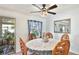 Charming dining room with decorative chairs, elegant decor, and natural light from the sliding door at 13492 Dibella Ave, Port Charlotte, FL 33981