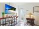 Light and airy entryway features stylish decor, elegant lamps, and a beautiful front door at 13492 Dibella Ave, Port Charlotte, FL 33981