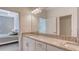 Stylish bathroom featuring granite counters with double sinks, and lots of lighting at 15332 Serene Shores Loop St, Bradenton, FL 34211