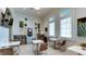 Cozy coffee bar area features a coffee machine, tables, and chairs for residents to enjoy at 15332 Serene Shores Loop St, Bradenton, FL 34211