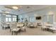Bright dining area with lots of light, neutral decor, and several tables and chairs at 15332 Serene Shores Loop St, Bradenton, FL 34211