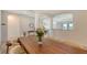 Elegant dining area featuring a wooden table with cream seating with views into the living area at 15332 Serene Shores Loop St, Bradenton, FL 34211