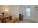 Bright dining room featuring a modern table, ample seating, and a stylish entryway at 15332 Serene Shores Loop St, Bradenton, FL 34211