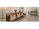 Dining area showcasing modern furniture and neutral tones, with a view into entryway at 15332 Serene Shores Loop St, Bradenton, FL 34211