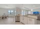 Open kitchen featuring granite counters, stainless steel appliances, and access to the living area at 15332 Serene Shores Loop St, Bradenton, FL 34211