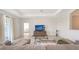 Cozy living room featuring a comfortable couch, entertainment center and views to other rooms at 15332 Serene Shores Loop St, Bradenton, FL 34211