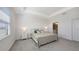 Tranquil main bedroom with tray ceiling, soft carpet, and ample natural light at 15332 Serene Shores Loop St, Bradenton, FL 34211