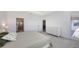 Spacious main bedroom with ensuite bathroom and a view of the outdoor patio at 15332 Serene Shores Loop St, Bradenton, FL 34211