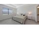 Inviting main bedroom with tray ceiling, plush carpet, and a serene atmosphere at 15332 Serene Shores Loop St, Bradenton, FL 34211