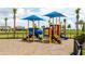 Playground with colorful play structures, slides, and climbing features at 15332 Serene Shores Loop St, Bradenton, FL 34211