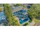 Aerial view of an estate featuring a pristine pool, outdoor living space, and beautifully landscaped grounds at 1540 Hillview Dr, Sarasota, FL 34239