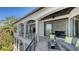 Overhead shot of a balcony with outdoor seating and lush tropical views at 1540 Hillview Dr, Sarasota, FL 34239