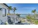 Relaxing outdoor balcony featuring stylish seating and scenic water views, perfect for enjoying the beautiful surroundings at 1540 Hillview Dr, Sarasota, FL 34239