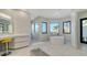 Bright bathroom with soaking tub, modern fixtures, and large windows showcasing beautiful outdoor scenery at 1540 Hillview Dr, Sarasota, FL 34239