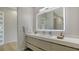 Modern bathroom with double vanity, sleek countertop, and illuminated mirror, creating a bright and stylish space at 1540 Hillview Dr, Sarasota, FL 34239